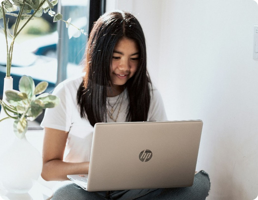 Child in therapy with computer on lap